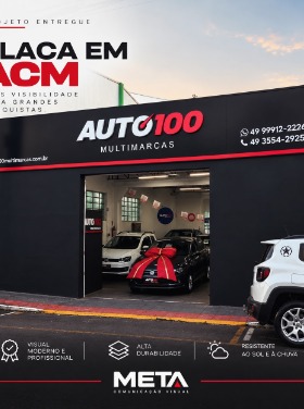 Fachada comercial Auto100 com comunicação visual